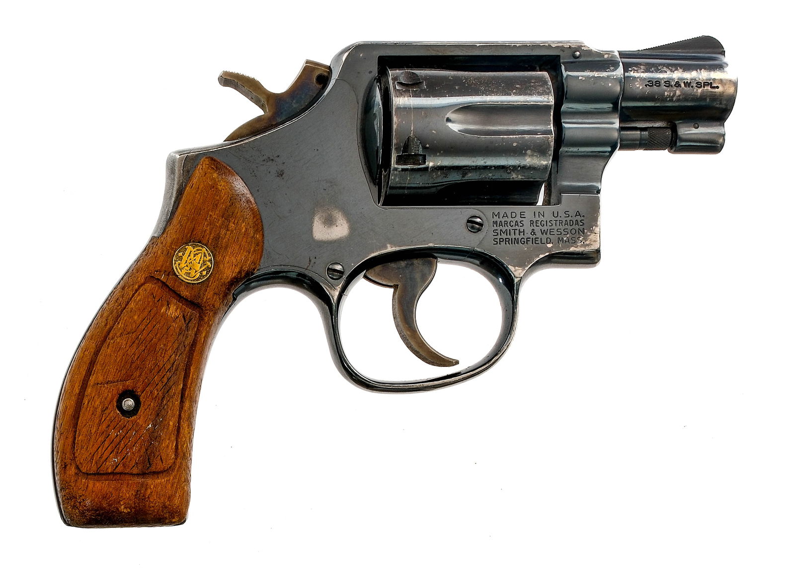 Smith & Wesson 10-7 .38 S&W Spl Revolver: Description Smith & Wesson Model 10-7 in .38 S&W Special with a six round capacity and a 2" barrel. Checkered wood grip plates. Blued frame, cylinder and barrel. Case colored serrated trigger and chec