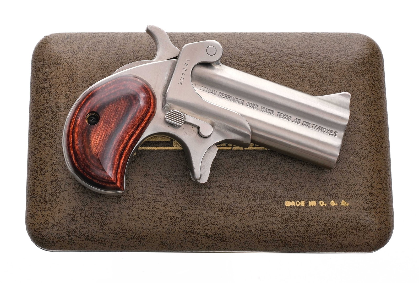 American Derringer M-1 .45 Colt/.410 Pistol: Description American Derringer Model 1 chambered in .45 Colt and .410 Bore with a two-shot capacity with automatic barrel selection, and 3" O/U barrel. Stainless steel barrel, frame, trigger, and hamm