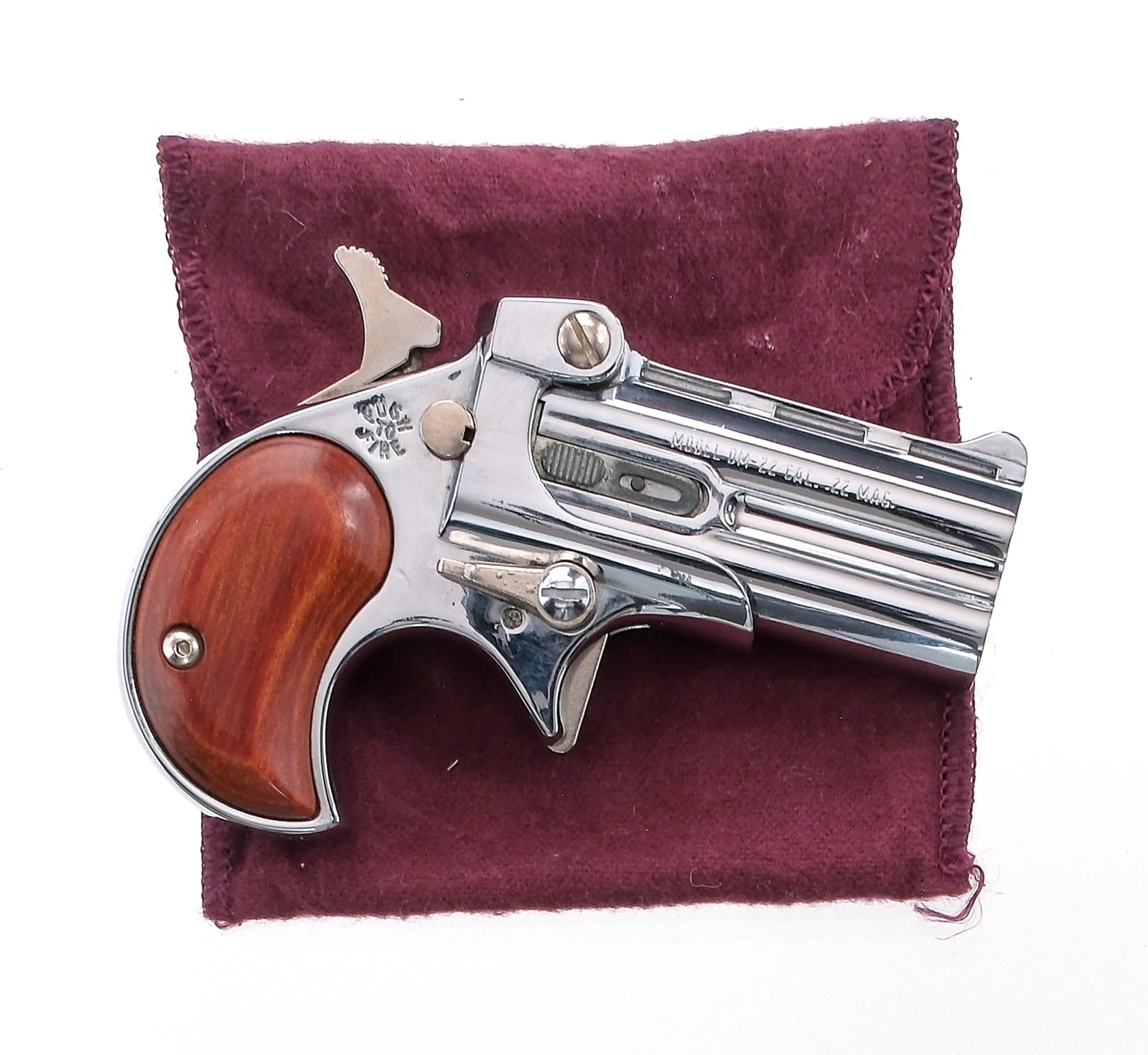 Davis Industries DM-22 .22 Magnum Derringer: Description Davis Industries DM-22 chambered in .22 Magnum with a two-shot capacity and a 2.5" barrel. Chrome metal finished frame and ribbed double barrel. Wood grip plates. Smooth solid trigger and 