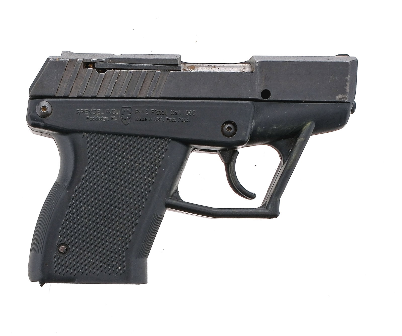 Grendel P-12 .380 ACP Semi Auto Pistol: Description Grendel Model P12 in .380 ACP missing its removable magazine with a 3" barrel. Checkered composite grip on frame. Composite trigger. Blued metal serrated slide. Left side slide release. Fr