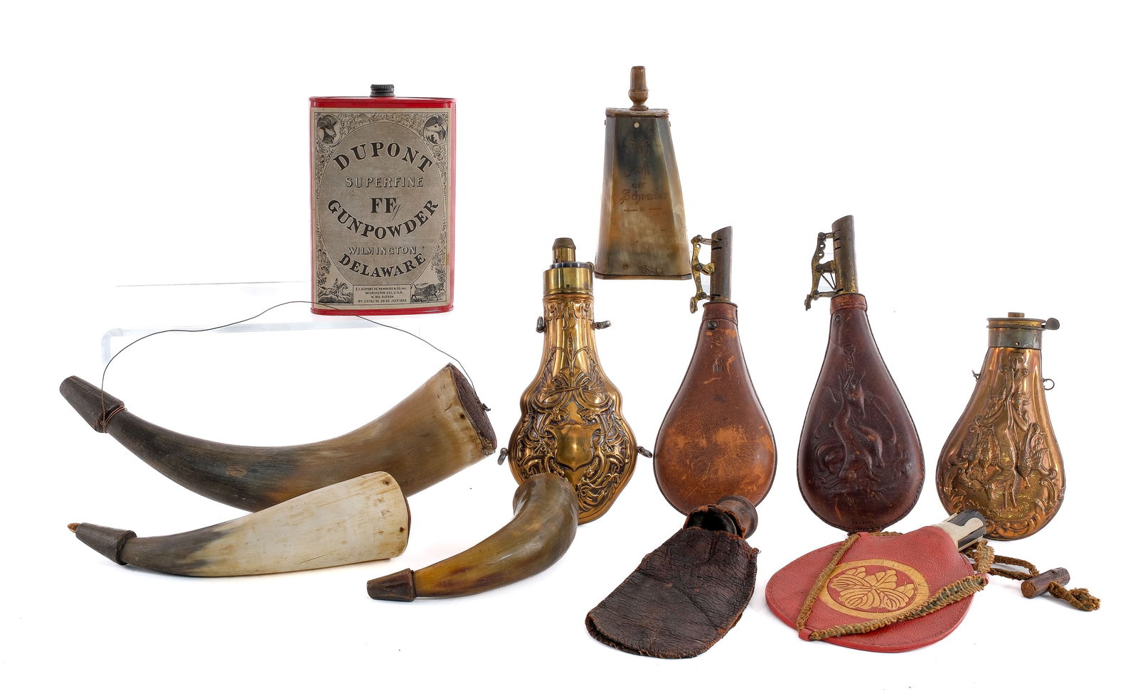 Powder Flask Lot 11 Pcs Flask / Container: Description Estate lot with eleven pieces including powder flask/horns and a container. One Dupont Superfine FF Gunpowder 1 pound can marked Wilmington Delaware July 1924. One broken copper and brass