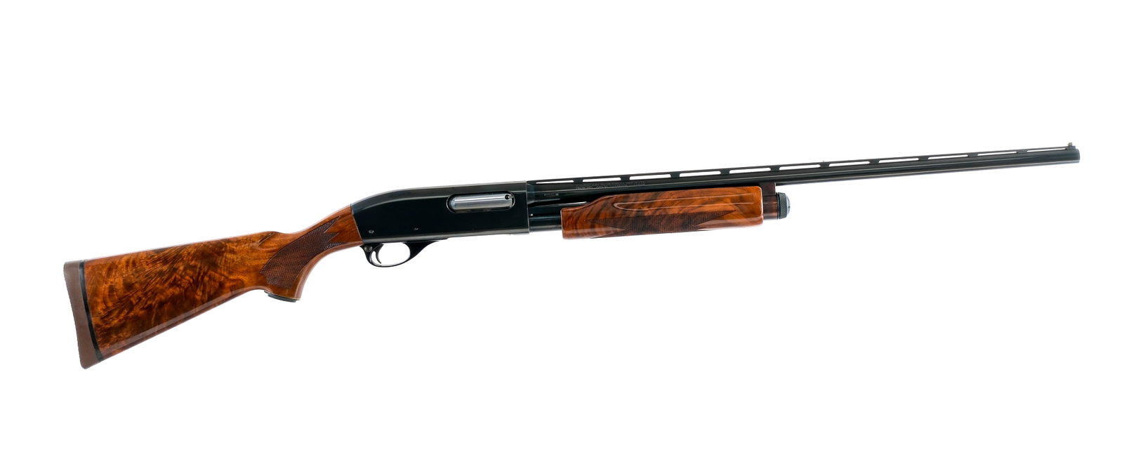 Remington 870 Wingmaster 20Ga Pump Shotgun: Description Remington Model 870 Wingmaster in 20 gauge 2 3/4" with a four round capacity and a 25.5" Imp CYL fixed choke top rib vented barrel. Textured rubber butt pad. Checkered high grade walnut st