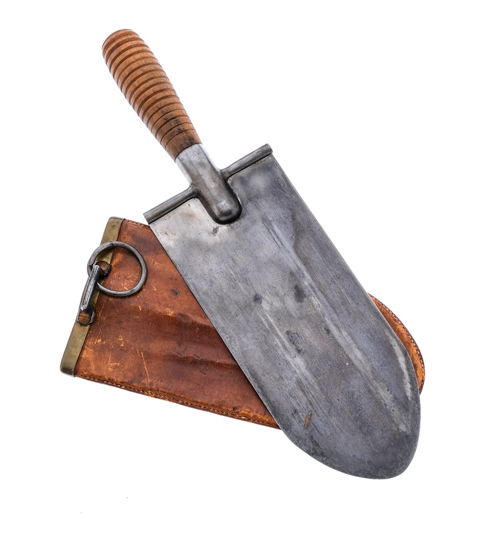 U.S. 1880 Trowel/Knife Entrenching Tool: Description U.S. Model 1880 Trowel/Knife Entrenching Tool with scabbard. Serrated wooden hand grip with U.S. stamp. 8" flat trowel blade. Overall length outside scabbard is 13". Wooden, brass and leat