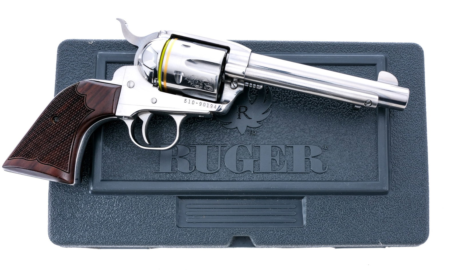 Ruger New Vaquero .45 LC Revolver: Description Ruger New Vaquero in .45 Long Colt with a six round capacity and a 5.5" barrel. Checkered wood grip plates. Polished steel frame, trigger, hammer, cylinder and barrel. Right side of frame 