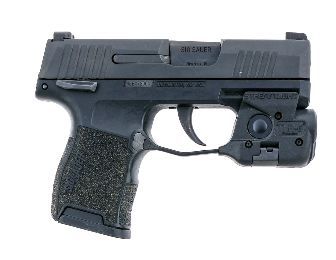 Sig Sauer P365 9mm Semi Auto Pistol: Description Sig Sauer Model P365 in 9mm with one, ten round removable magazine and a 3" barrel. Textured black composite grip on frame. Blued trigger, serrated slide and barrel. Left side of frame mag