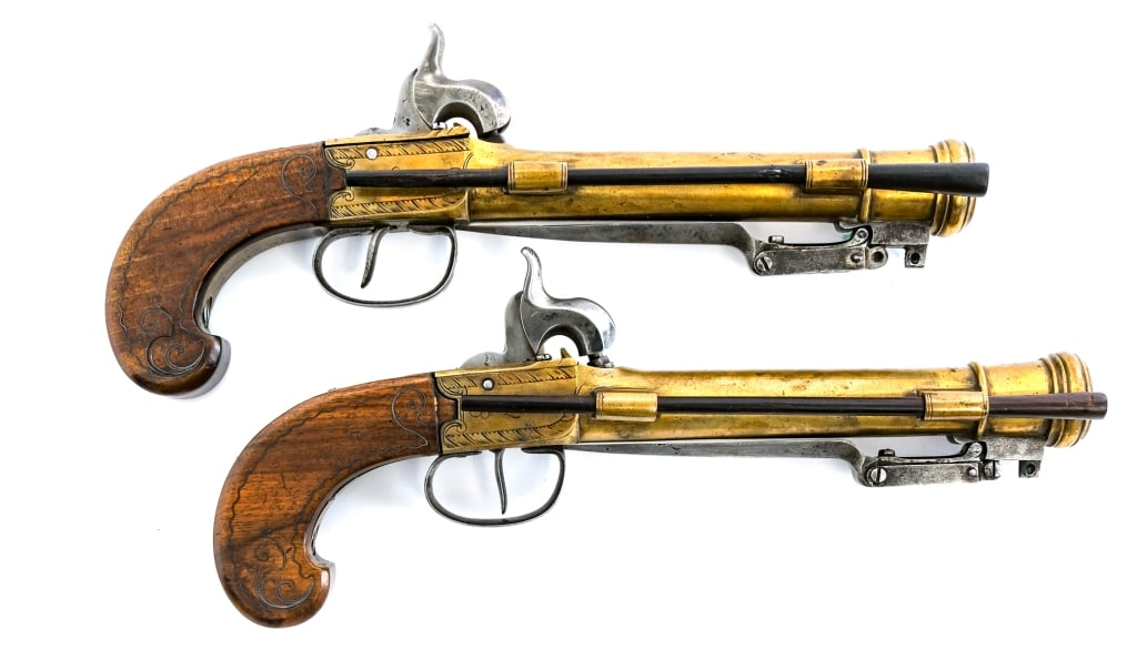 Brass Cannon Barrel Blunderbuss Percussion Pistols: Description A pair of unique and desirable brass cannon style barrel blunderbuss pistols with underfolding bayonet. These are a matching pair with manufacturer mark "BERLEUR" of Liege, Belgium dating 