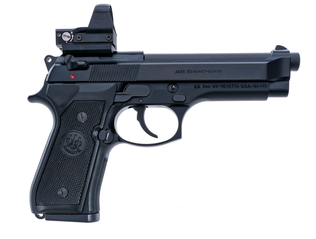 Beretta M9 W/ Leupold DP Pro 9mm Semi Auto Pistol: Description Beretta M9 chambered in 9mm with one, fifteen round removable magazine and a 4.9" barrel. Black alloy frame with checkered polymer grips. Double/single action trigger and hammer. Black fin