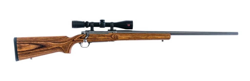 Ruger M77 Mark II .220 Swift Bolt Action Rifle: Description Ruger M77 Mark II in .220 Swift with a four round capacity and a 26" barrel. Rubber butt pad. Made in Southport Connecticut in 1997. Smooth laminated wood stock. Matte steel trigger guard,