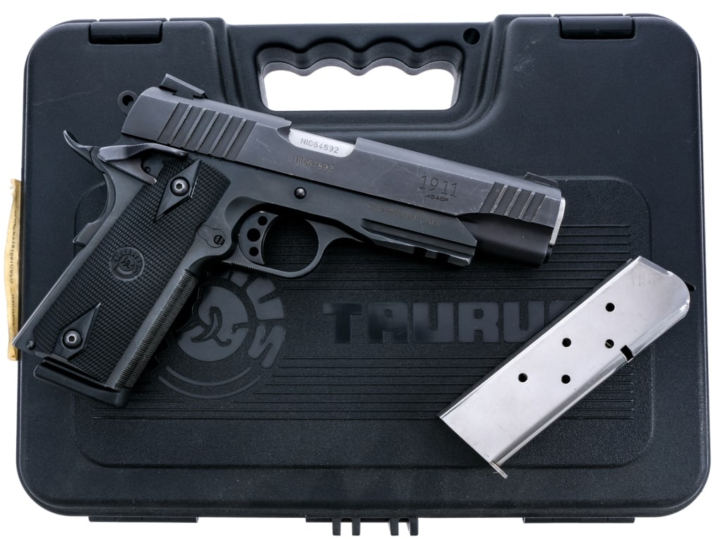 Taurus PT1911 .45 ACP Semi Auto Pistol: Description Taurus Model PT-1911 in .45 ACP with two, eight round removable magazines and a 5" barrel. Checkered black composite grip plates. Blued frame, serrated skeletonized trigger, hammer and ser