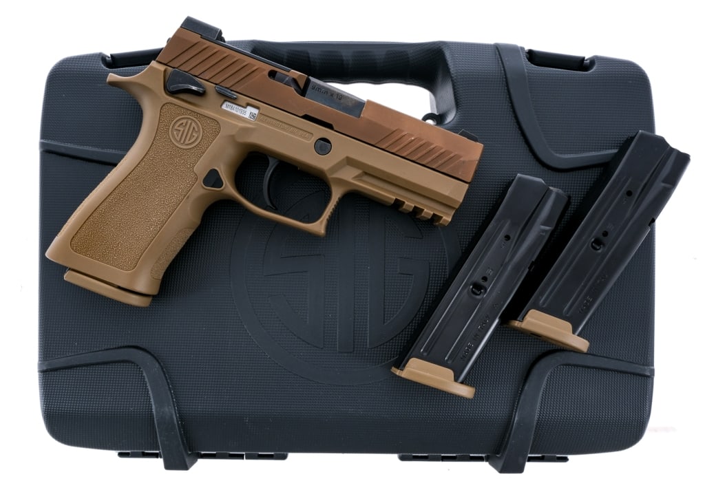 Sig Sauer P320 M18 9mm Semi Auto Pistol: Description Sig Sauer P320 M18 chambered in 9mm with three, ten round removable magazines and a 3.9" carbon steel barrel. FDE polymer frame with textured grip and under barrel accessories rail. Standa