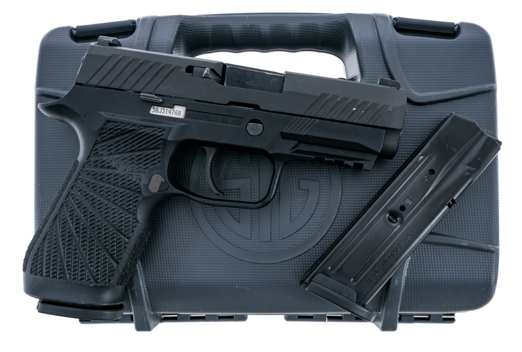 Sig Sauer P320 9mm Semi Auto Pistol: Description Sig Sauer P320 chambered in 9mm with two, ten round removable magazines and a 3.9" barrel. Wilson Combat textured polymer grip frame with picatinny accessories rail. Standard curved strike