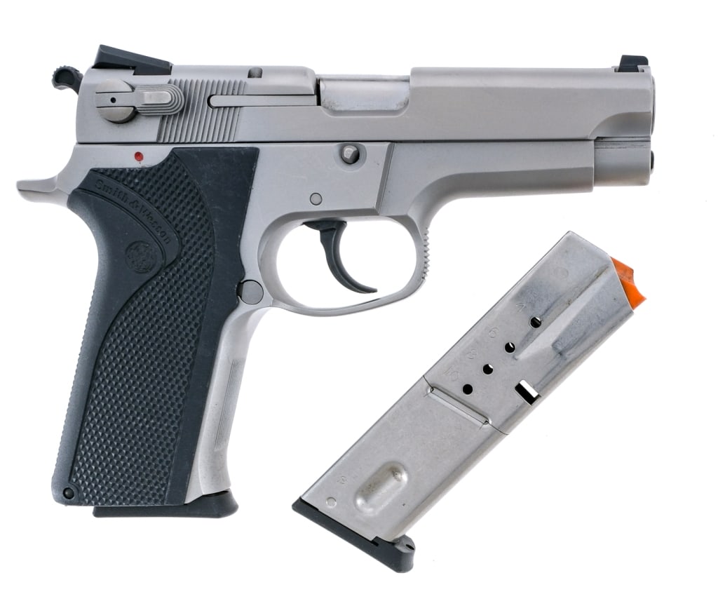 Smith & Wesson 5906 9mm Semi Auto Pistol: Description Smith & Wesson 5906 chambered in 9mm with two, ten round removable magazines and a 3.875" barrel. Stainless steel frame with checkered polymer grips. Double/single action trigger and hamme