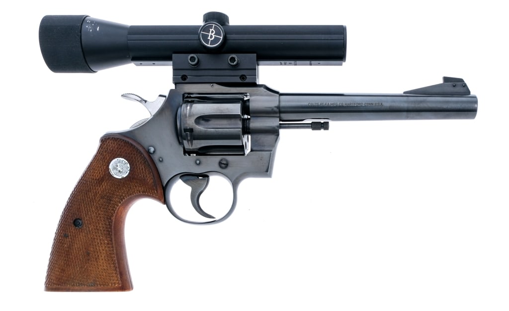 Colt Officers Model Match .22 LR Revolver: Description Colt Officers Model Match in .22 Long Rifle with a six round capacity and a 6" barrel. Made in Hartford Connecticut in 1957. Checkered Colt medallion wood grip plates. Blued serrated trigg