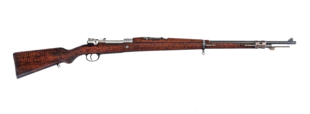 DWM Argentine Mauser 1909 7.65x53mm Rifle: Description DWM Argentine Mauser Modelo 1909 chambered in 7.65x53mm Argentine with a five round integral magazine and a 22" barrel. Imported by SAMCO, marked on the barrel. Front cleaning rod and bayo