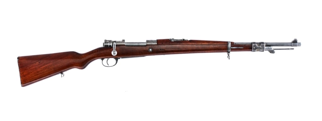 DWM Argentine Mauser 1909 7.65x53mm Rifle: Description DWM Argentine Mauser Modelo 1909 chambered in 7.65x53mm Argentine with a five round integral magazine and a 22" barrel. Front cleaning rod and bayonet lug. Unfinished bolt with flag style