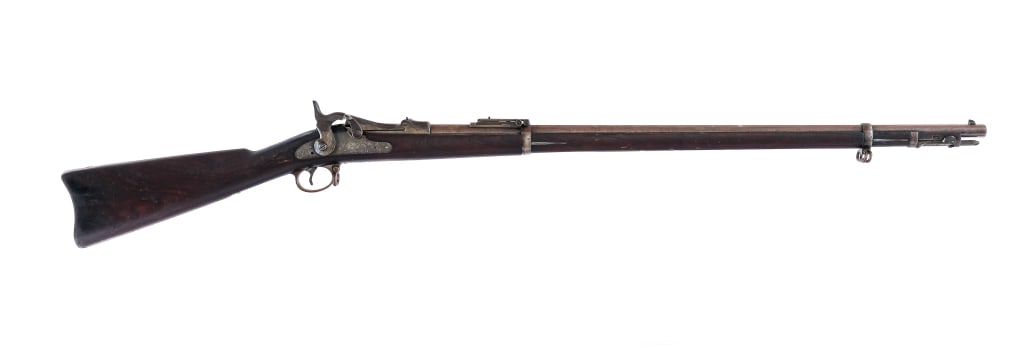 U.S. Springfield 1884 Trapdoor .45-70 Govt Rifle: Description U.S. Springfield Model 1884 Trap Door chambered in .45-70 Government with a 32.5" barrel. Made in Massachusetts in 1893. The barrel is marked "V" / "P" / Eagle / "P. The trapdoor is marked