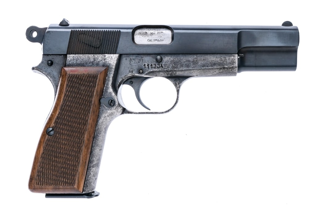 FN Browning Hi Power 9mm Semi Auto Pistol: Description Fabrique Nationale Hi Power chambered in 9mm with one, thirteen round removable magazine and a 4.7" barrel. The frame is dated to 1962 with serial number 111334. The slide and frame are li