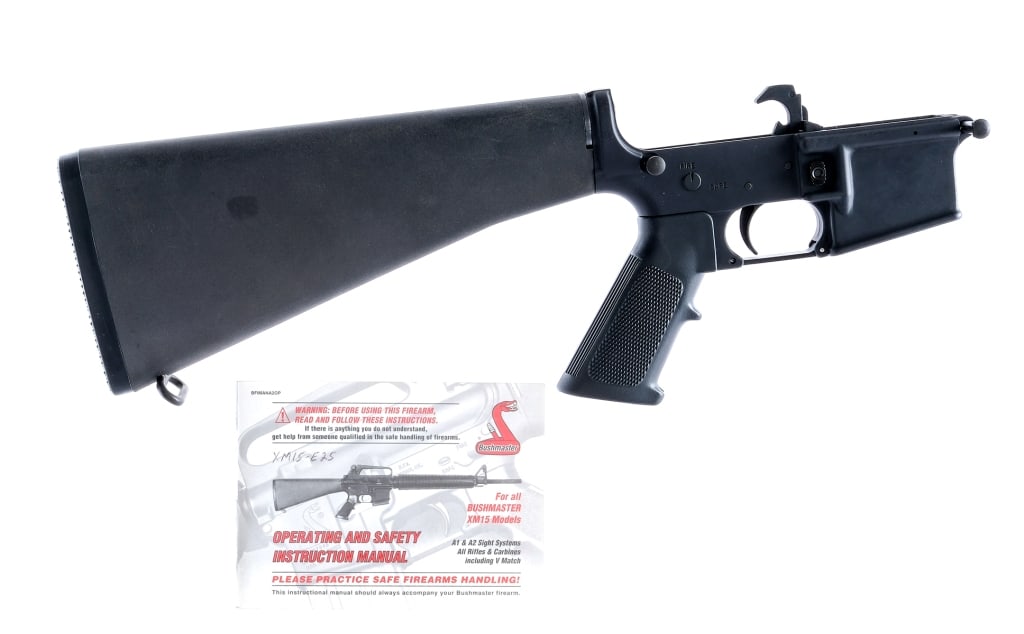 Bushmaster XM15-E2S 5.56 Complete Lower Receiver: Description Bushmaster XM15-E2S Complete AR15 lower receiver for .223/5.56. Black finished forged aluminum. Standard AR15 controls/lower parts. Textured A2 style pistol grip and fixed rifle stock. Mus