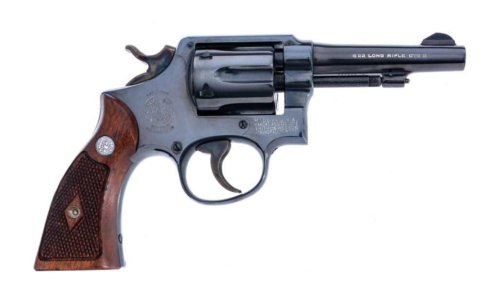 Smith & Wesson M&P Post Office .22 LR Revolver: Description Smith & Wesson Military Police Post Office Pre-Model 45 in .22 Long Rifle with a six round capacity and a 4" barrel. Checkered S&W checkered diamond wood grip plates. Case colored serrated