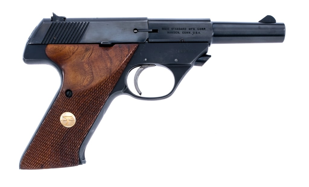 Hi-Standard Sport King .22 LR Semi Auto Pistol: Description HI-Standard Sport King chambered in .22 long rifle with two, ten round removable magazines and a 4.5" barrel. Blued steel frame with checkered wood grips. Serrated heel magazine release. F