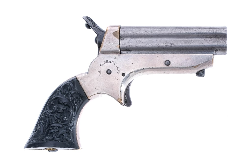 C. Sharps Pepperbox 1A.22 RF Pistol: Description C. Sharps Pepperbox Model 1A chambered in .22 Rimfire Short with a four round capacity and a 2.5" quad barrel. Blued barrels and nickel finished brass frame. Blued single action trigger an