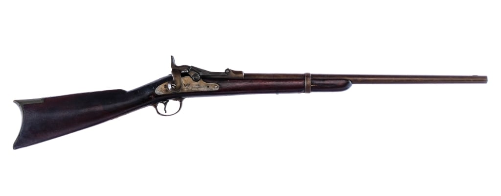 U.S. Springfield 1873 Trapdoor .45-70 Govt Rifle: Description U.S. Springfield Model 1873 Trapdoor Carbine in .45-70 Govt with a single round capacity and a 22" barrel. Brass butt plate. Smooth wood stock and front forend. Finish worn serrated trigge
