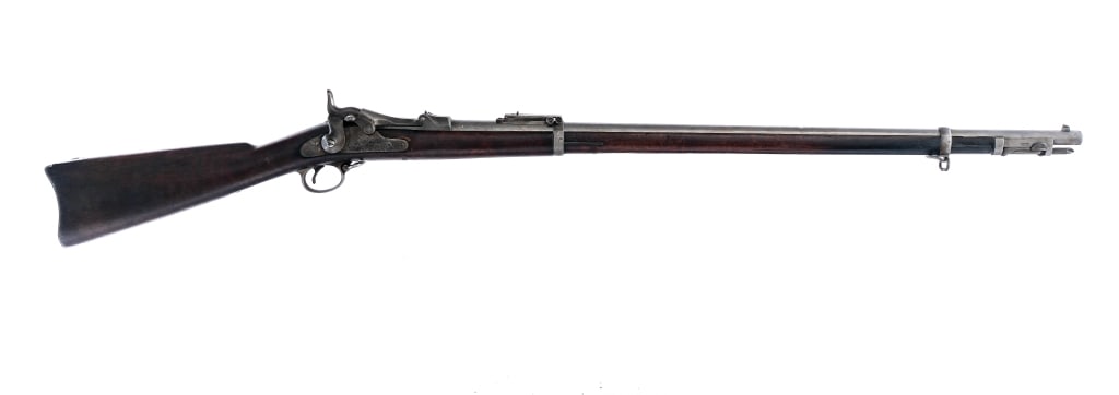 U.S. Springfield 1884 Trapdoor .45-70 Rifle: Description U.S. Springfield 1884 Trapdoor chambered in .45-70 with a single shot capacity and a 32" barrel. Front round rod spike bayonet. Adjustable rear Buffington sight and fixed front blade. The