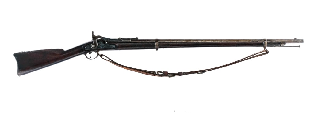 U.S. Springfield Trapdoor .45-70 Single Shot Rifle: Description U.S. Springfield Trapdoor chambered in .45-70 with a single shot capacity and a 32.5" barrel. Patinated blued finish. Adjustable rear sight and fixed front blade. Smooth wood straight grip