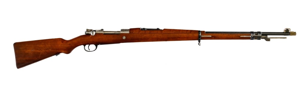 DWM Argentine Mauser 1909 7.65x53mm Rifle: Description DWM Argentine Mauser Modelo 1909 chambered in 7.65x53mm Argentine with a five round integral magazine and a 29.1" barrel. Front cleaning rod and bayonet lug. Unfinished bolt with flag styl