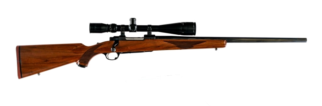 Ruger M77 Tang Safety .243 Win Bolt Action Rifle: Description Ruger M77 chambered in .243 Winchester with a four-round capacity and a 24" barrel. Manufactured in 1989 with serial number 772-17933. Blued barrel, receiver, and bolt handle. The receiver