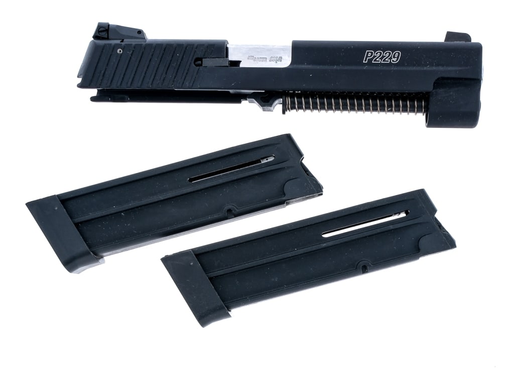 Sig Sauer P229 .22 LR Conversion Kit: Description Sig Sauer P229 .22 long rifle conversion kit with two, ten round removable magazines and a 4.5" stainless barrel. Black finished serrated slide with white three-dot iron sights. The rear s