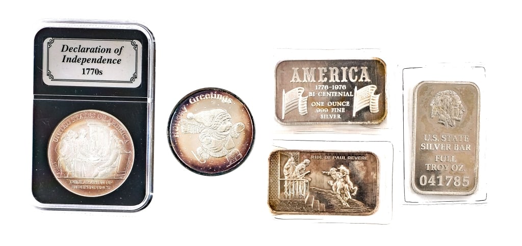 Miscellaneous 1 oz Silver Coins/Bars 5-Peices: Description This lot is for five miscellaneous 1 oz silver rounds/bars. First is three 1 oz silver bars with various designs. One shows a design of the Ride of Paul Revere. The second is an American B