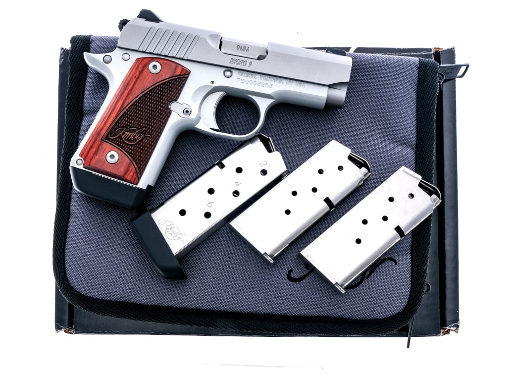 Kimber Micro 9 9mm Semi Auto Pistol: Description Kimber Micro 9 chambered in 9mm with four, six round magazines and a 3.15" barrel. Aluminum alloy frame with checkered wood Kimber grips. Single action trigger and exposed hammer. Frame mo