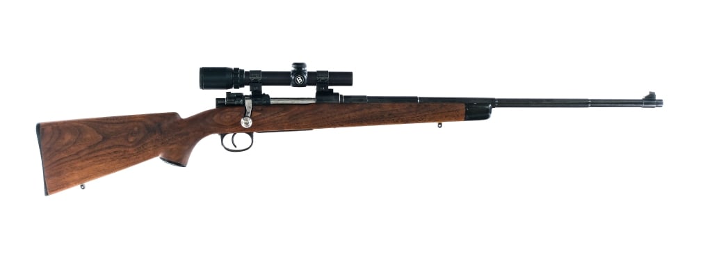 Sporterized WWII German K98 8mm Mauser Rifle: Description Sporterized World War II Third Reich Era German K98 chambered in 7.92x57mm Mauser (8mm Mauser) with a five round internal magazine and a 24" barrel. Blued barrel, receiver, floorplate, and