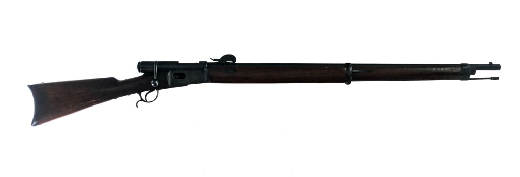 Swiss Vetterli M-1878 10.4x38mm Bolt Action Rifle: Description Waffenfabrik Bern Vetterli Model 1878 in 10.4x38mm Swiss with a twelve round capacity and a 33" barrel. Made in Switzerland. Metal butt plate. Smooth wood stock and front forend. Finish wo