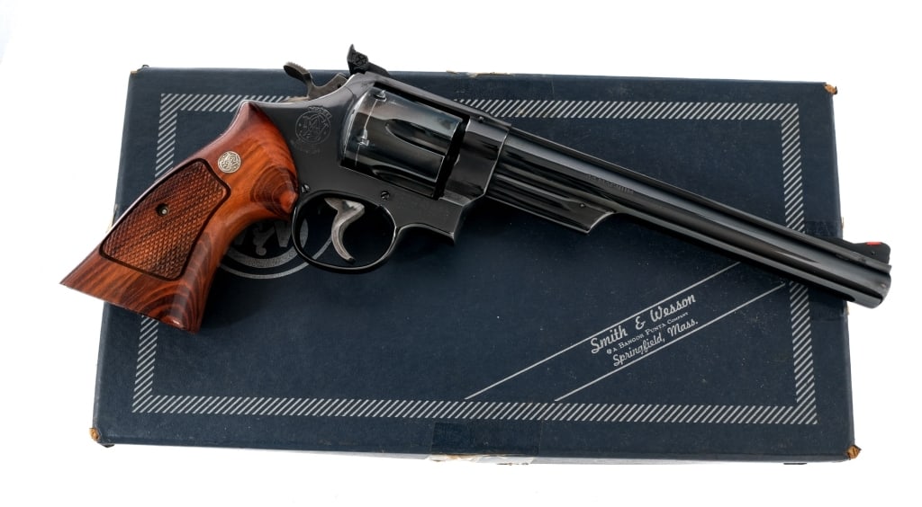 Smith & Wesson 29-2 .44 Magnum Revolver: Smith & Wesson Model 29-2 in .44 Magnum with a six round capacity and a 8.25" barrel. Made in Springfield Massachusetts between 1977 and 1978. Checkered Goncalo Alves grip plates. Blued frame, cylinde