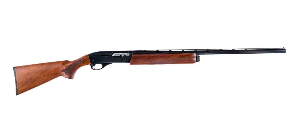 Remington 1100 LT 20 Ga Semi Auto Shotgun: Remington Model 1100 LT in 20 gauge 2 3/4" with a four round capacity and a 27.5" barrel. Made in Madison North Carolina in 2010. Checkered composite butt plate. Checkered wood stock and front foregri