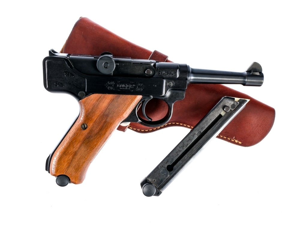 Stoeger Arms Luger .22 LR Semi Auto Pistol: Stoeger Arms Corporation Luger in .22 long rifle with two, ten round removable magazine and a 4.5" barrel. Black alloy frame with smooth wood grips. Push button magazine release and manual thumb safet