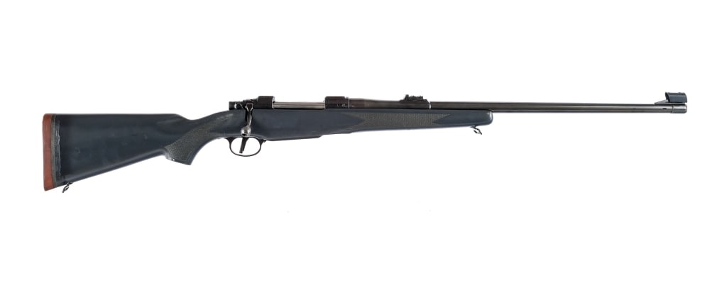 CZ 602 ZKK .338-370 WBY Magnum Bolt Action Rifle: CZ 602 ZKK in .338-370 Weatherby Magnum with a four round capacity and a 25" ported barrel. Made in the Czech Republic in 1994. Checkered Monte Carlo style composite stock. Blued trigger, receiver and