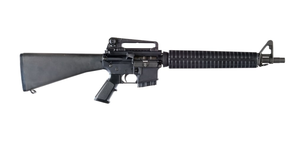 Bushmaster XM15-E2S Dissipator 5.56x45mm Rifle: Bushmaster XM15-E2S Dissipator style chambered in 5.56x45mm with one, ten round magazine and a 16" featureless barrel. A2 style front gas block with adjustable front sight post. Rifle length polymer h