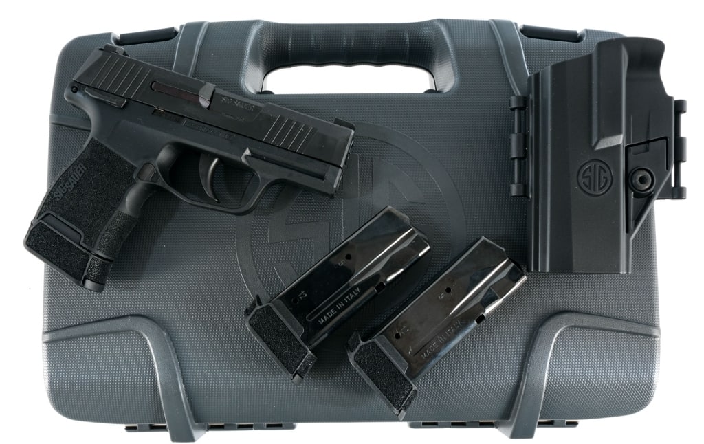 Sig Sauer P365 9mm Semi Auto Pistol: Sig Sauer Model P365 in 9mm with three, ten round removable magazines and a 3" barrel. Textured composite grip on frame. Blued trigger, serrated slide and barrel. Left side of frame slide release and