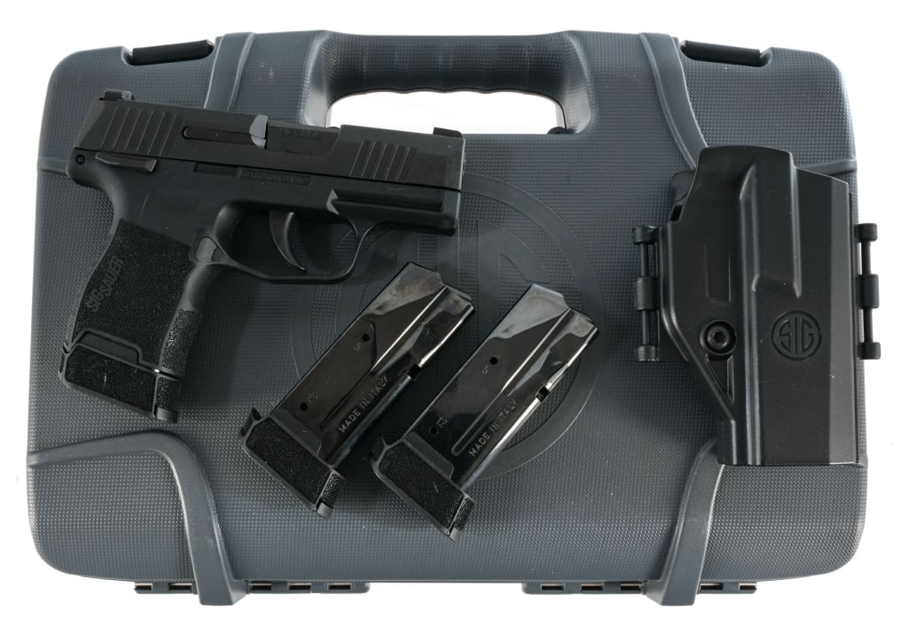 Sig Sauer P365 9mm Semi Auto Pistol: Sig Sauer Model P365 in 9mm with three, ten round removable magazines and a 3" barrel. Textured composite grip on frame. Blued trigger, serrated slide and barrel. Left side of frame slide release and