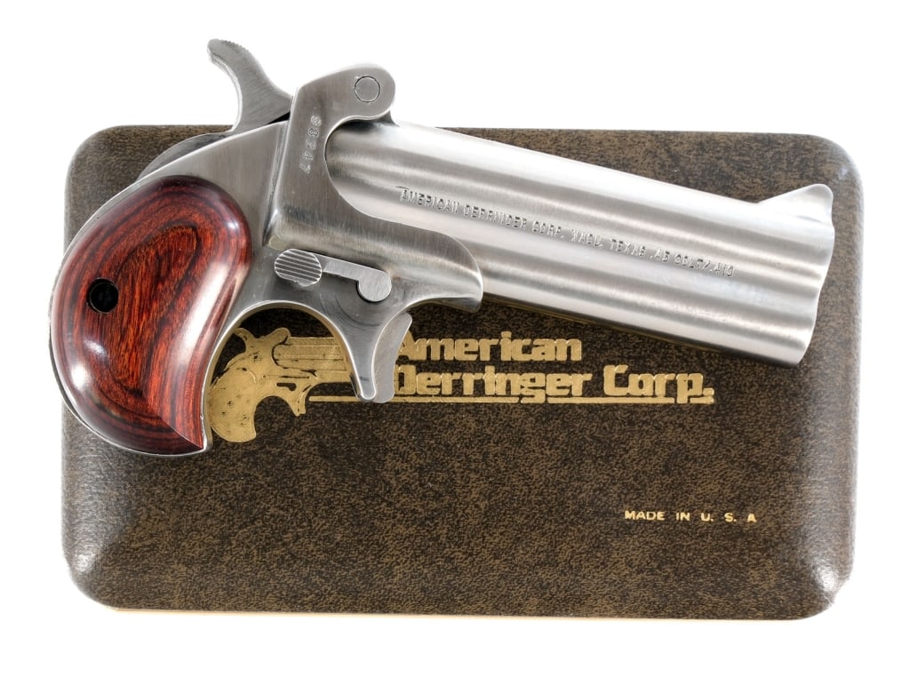American Derringer M4 .45 Colt / .410 Ga Pistol: American Derringer Corporation M-4 ( Model 4 ) in .45 Long Colt or .410 gauge with a two round capacity and a 4" over under double barrel. Smooth rosewood grip plates. Polished satin stainless steel f