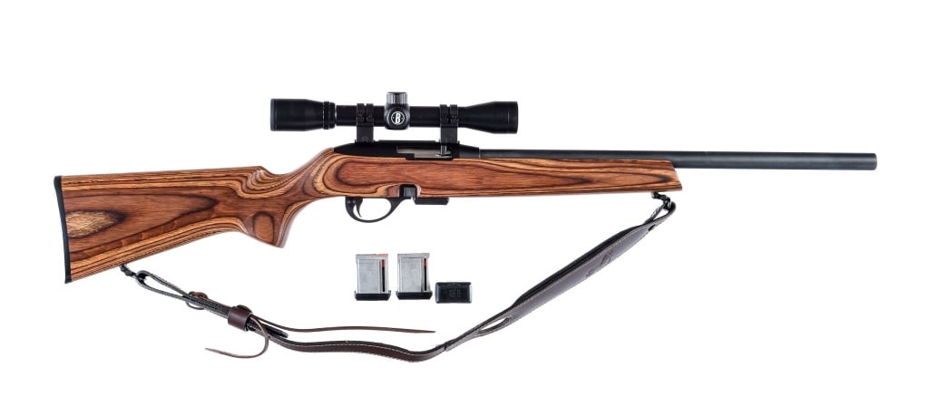 Remington 597 Magnum .22 Win Mag Rifle: Remington Model 597 Magnum in .22 Winchester Magnum with four, eight round removable magazines and a 20" heavy bull barrel. Laminated wood stock. Anodized receiver and blued barrel. Rear trigger guard