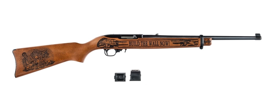 Ruger 10/22 Build The Wall .22 LR Rifle: Ruger 10/22 Trump Build The Wall chambered in .22 Long Rifle with three, ten round rotary magazines and an 18.5" barrel. Manufactured in 2019. Number 3 of only 45 manufactured. Adjustable rear sight a