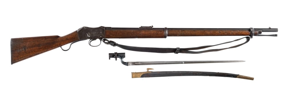 Enfield Martini Henry MK III .577/450 Rifle: Martini Henry MK III chambered in .577/.450 with a single-shot capacity and a 33" barrel. Adjustable rear ladder sight and fixed front blade. Front bayonet lug and cleaning rod. Blued finish with wood