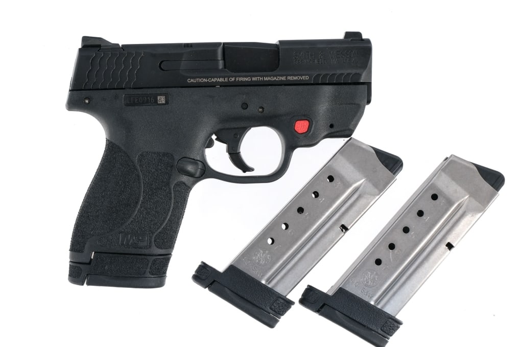 S&W M&P 40 Shield .40 S&W Semi Auto Pistol: Smith & Wesson M&P 40 Shield chambered in .40 Smith & Wesson with three, seven round magazines and a 3.1" barrel. Textured polymer frame with built in Crimson Trace laser. Striker fired trigger with s