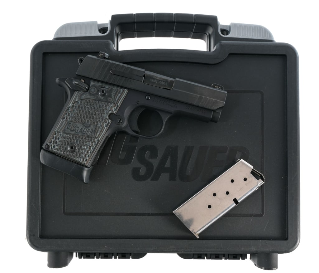 Sig Sauer P938 Extreme 9mm Semi Auto Pistol: Sig Sauer P938 Extreme chambered in 9mm with two, six round magazines and a 3" barrel. Black alloy frame with textured polymer grips. Single action trigger. Ambidextrous thumb safety. Gray finished st