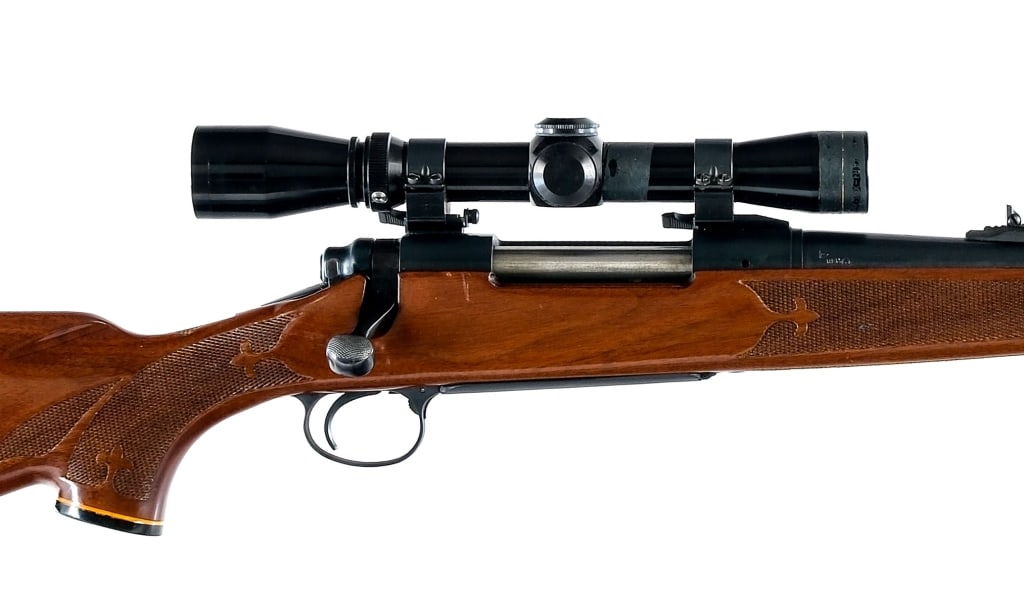 Remington 700 7mm Rem Mag Bolt Action Rifle: Remington 700 chambered in .300 Winchester Magnum with a four round capacity and a 24" barrel. Rubber butt pad. Checkered Monte Carlo style stock. Blued trigger guard, receiver and barrel. Rear right
