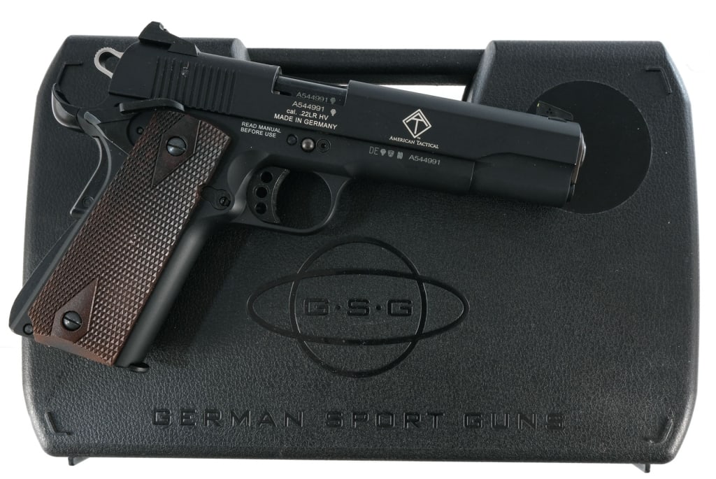 GSG 1911 .22 LR Semi Auto Pistol: UPDATE: Comes with one removable magazine. German Sport Guns 1911 chambered in .22 Long Rifle with three, ten round magazine and a 5" barrel. Alloy frame with checkered wood grips. Single action trigg